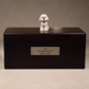 Dark wood custom pet ashes urn box showing a personalized 3D resin figurine (white dog example) and engraved plaque; a bespoke memorial solution suitable for holding the ashes of any beloved animal companion, including cats, birds, and small mammals.