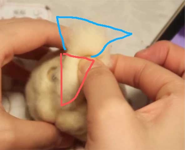 Sculpting a 3D cat nose bridge with a fan-shaped wool tuft and a No. 38 needle for a custom needle felted pet sculpture.