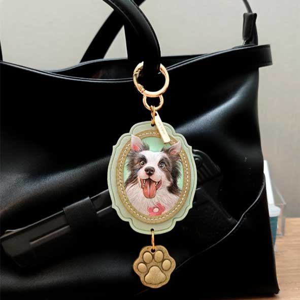 A detailed, hand-carved Border Collie silhouette on a vegetable-tanned leather custom pet gifts tag, hanging as a minimalist art charm on a luxury handbag, showcasing custom gifts for pet owners who prioritize artisanal craft.