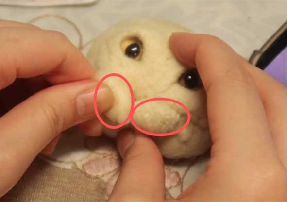 Sculpting a plump cat muzzle for a custom needle felted pet sculpture using two small wool balls and a 3-needle tool for realistic texture.