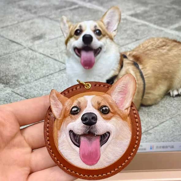 A detailed, hand-carved Corgi silhouette on a finished vegetable-tanned leather custom pet gifts tag, featuring artisanal textures and a vintage brass clasp for high-quality personalized dog gifts.