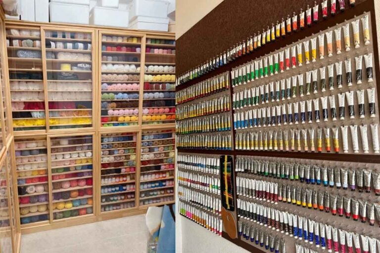 A wall-mounted display of hundreds of oil paint tubes and a wooden cabinet filled with colorful New Zealand wool yarn balls for creating custom stuffed animals.