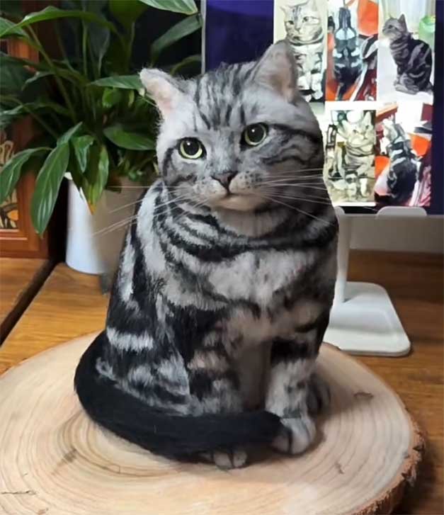 A realistic cat creation of a silver tabby, showcasing hand-layered wool fibers and natural transitions in the coat pattern.