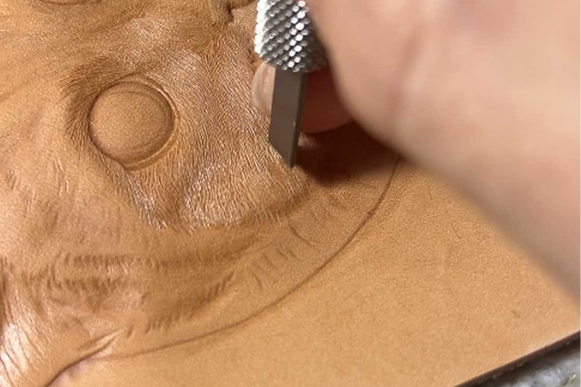 Handmade leather art, showcasing intricate carving knife marks and subtle texture variations, highlighting the unique charm of handcrafted craftsmanship