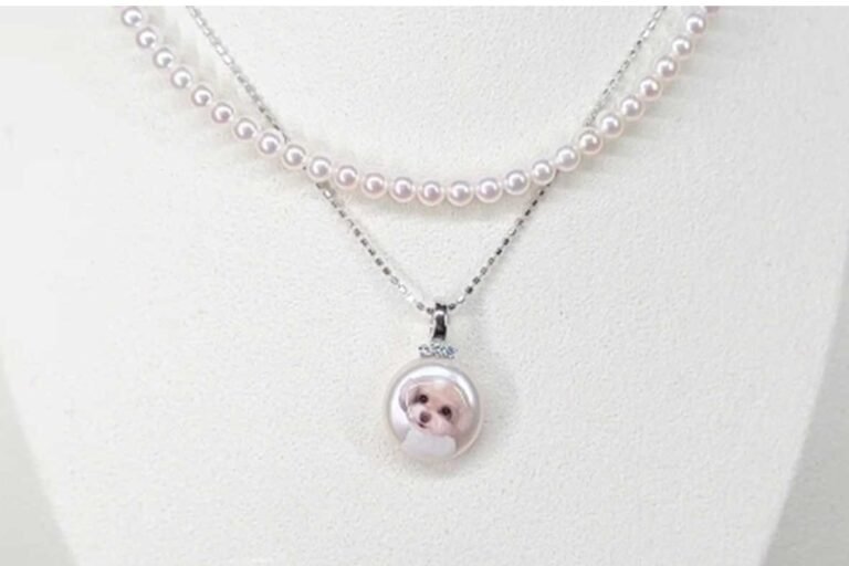 High-end custom pet necklace set featuring a hand-painted dog portrait pendant on a pearl and a matching pearl choker.