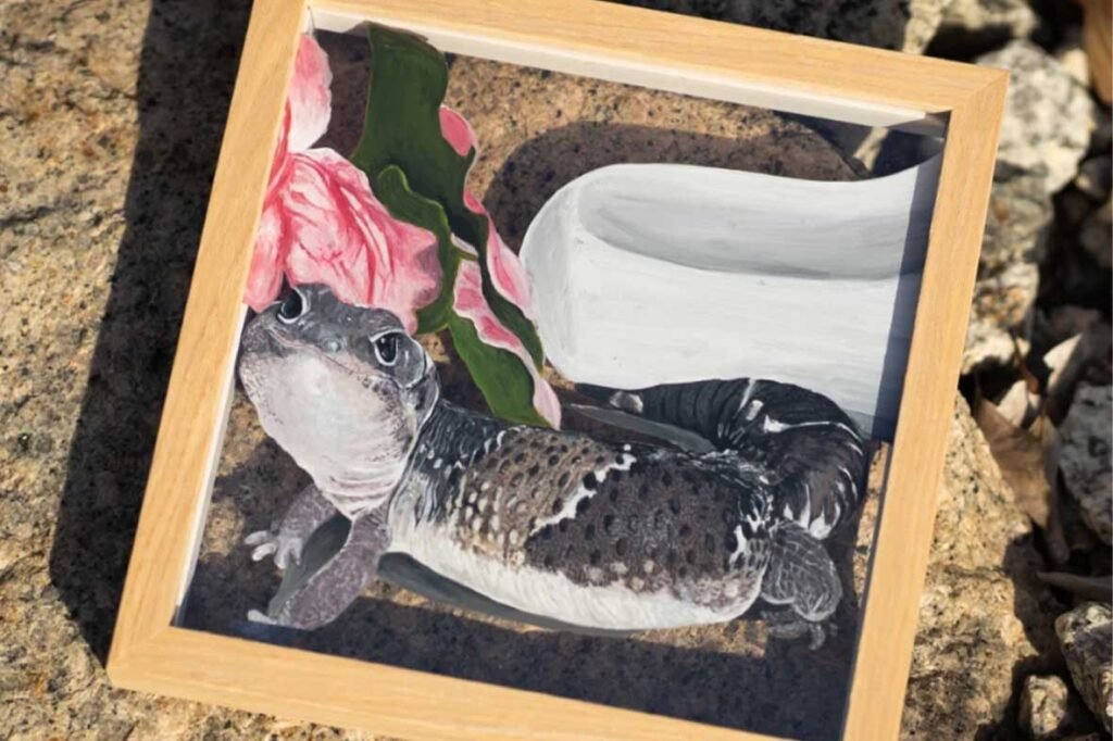 Framed custom gecko portrait painting showing a Leopard Gecko in a mid-climb pose with realistic skin patterns and scales.